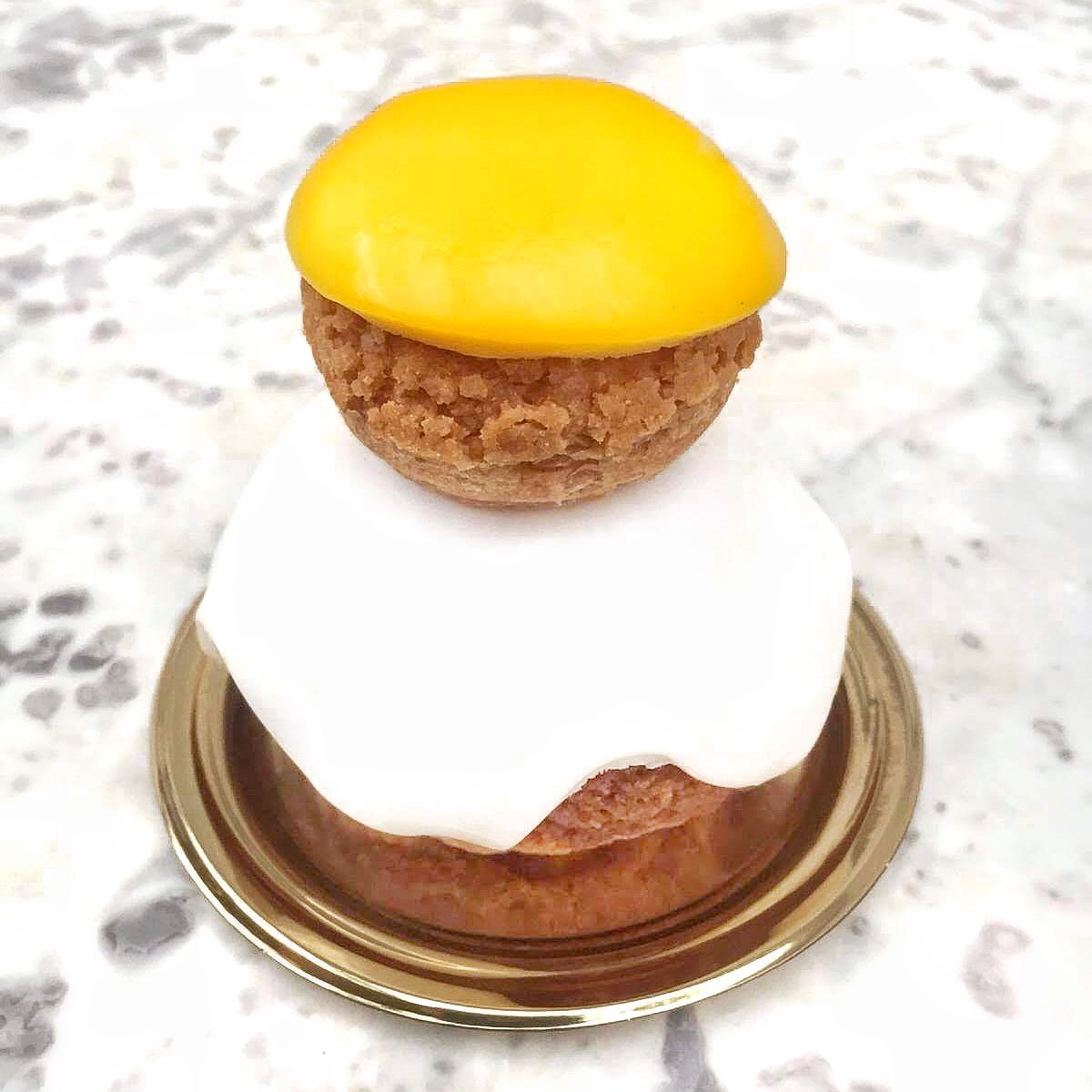 Introducing our Sunny Side Up Religieuse, just in time for Easter, filled with creamy milk chocolate crémeux and passionfruit caramel. Available here at #DABLondon from 19th to 21st April (preorders are up online at DominiqueAnselLondon.com too). #DABEaster #HappyEaster