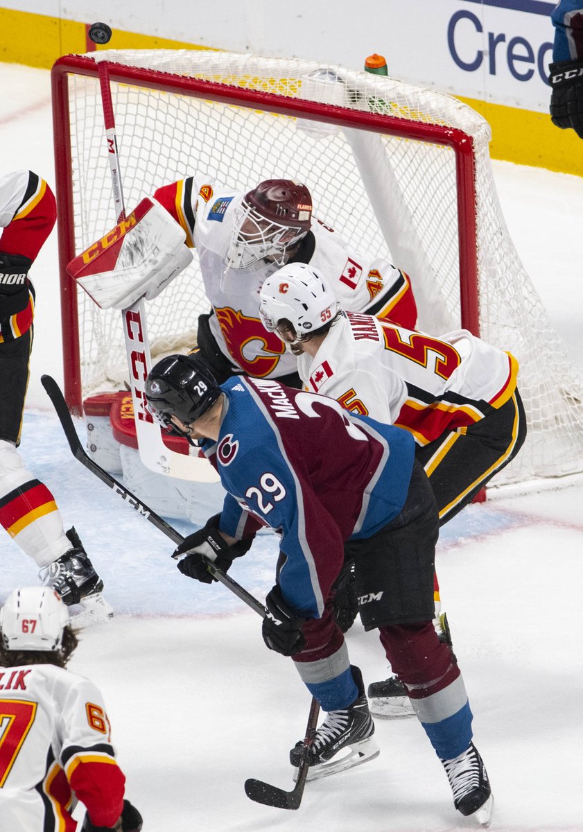 So Close. Colorado center Nathan MacKinnon misses top left as Calgary goalie Mike Smith defends during the second period of Game 4 Wednesday, April 17, 2019, at the Pepsi Center in Denver, Colo.  (The Gazette, Christian Murdock) <a href="/csgazette/">The Gazette</a> <a href="/CSGazetteSports/">Gazette Sports</a> #NHLPlayoffs