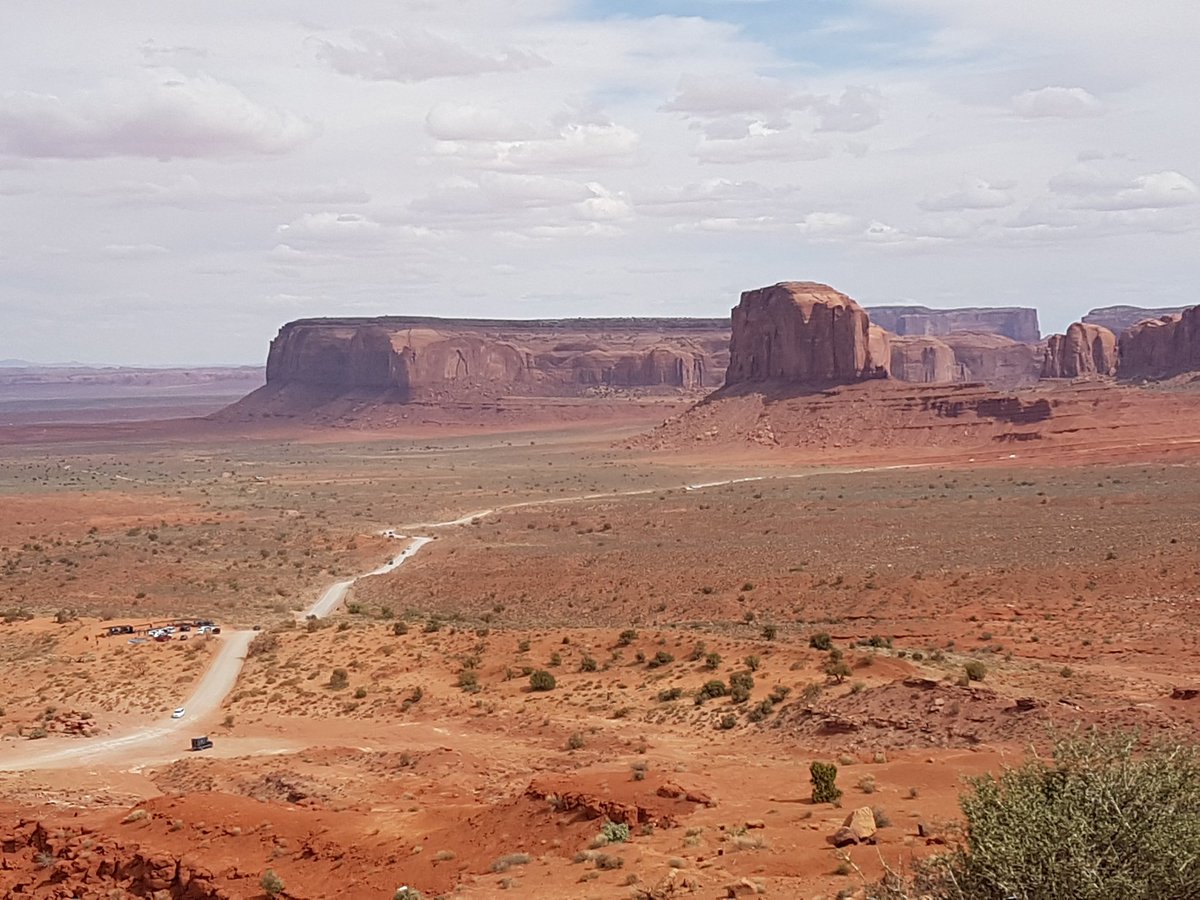camundson1's tweet photo. An incredible afternoon at #MonumentValley with the towering sandstone buttes and different rock formations! Our guide helped us explore more of the area and learn more about the Navajo people. https://t.co/vHcbh2StoB
