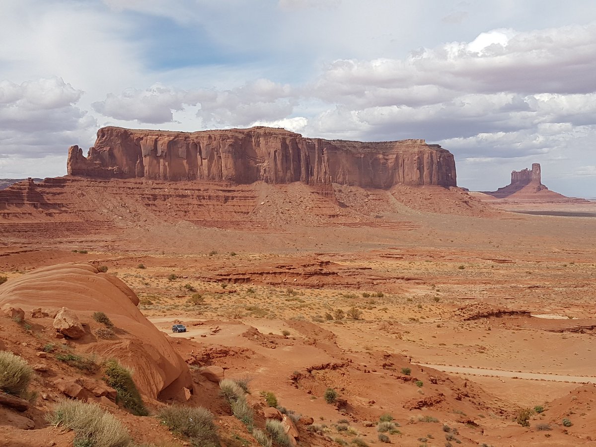 camundson1's tweet photo. An incredible afternoon at #MonumentValley with the towering sandstone buttes and different rock formations! Our guide helped us explore more of the area and learn more about the Navajo people. https://t.co/vHcbh2StoB