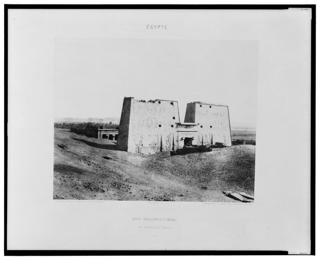 The earliest photographs I've found are by Félix Teynard, c. 1851. They still show houses around the temple . . . http://www.loc.gov/pictures/item/2001695318/