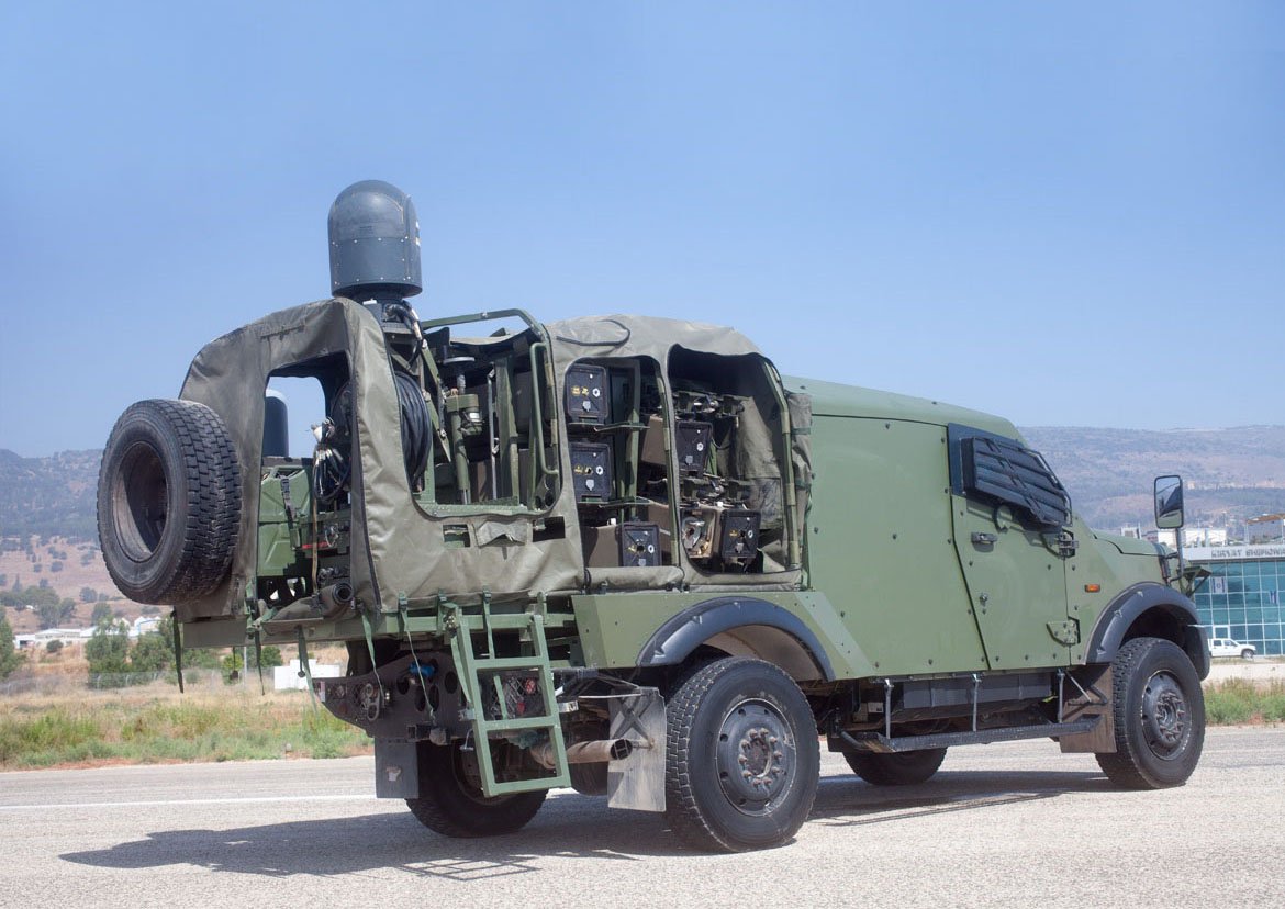 Plasan, in addition to armour, design & manufacture entire vehicles. Of these, the 2nd Gen Sand Cat is of interest, a Ford F550 and new build v-hull. With the amount of Ford and Plasan's own fabrication in the UK, there is surprising scope for local design/build. Also Yagu.25/