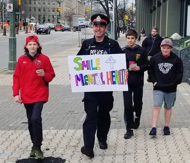 Thanks for taking this picture <a href="/richannesley/">Rich Annesley</a> I'm all about bringing awareness and acceptance to Mental Health. So much so that I found myself holding this sign while walking in downtown #ldnont with some awesome young people from <a href="/StTheresaShark/">St.Theresa, London</a> this morning. Handing out coffee!