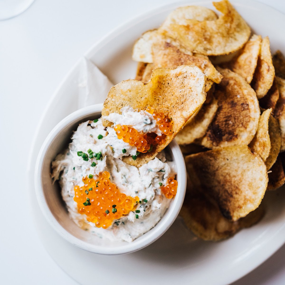 Our idea of a good time: smoked trout mousse w/ trout roe and house kelp-seasoned chips! #smokedtrout #kelp #housechips #chipsanddip #woodfordfb