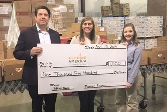 Mark McQueenie, Area Vice President, and Naomi Robinson, Branch Manager, from Mariner Finance in Elizabethtown, KY recently presented  <a href="/FeedingAmerica/">Feeding America</a>  Kentucky's Heartland with a donation made possible by <a href="/JeffiesChoice/">Jeffie's Choice</a>.