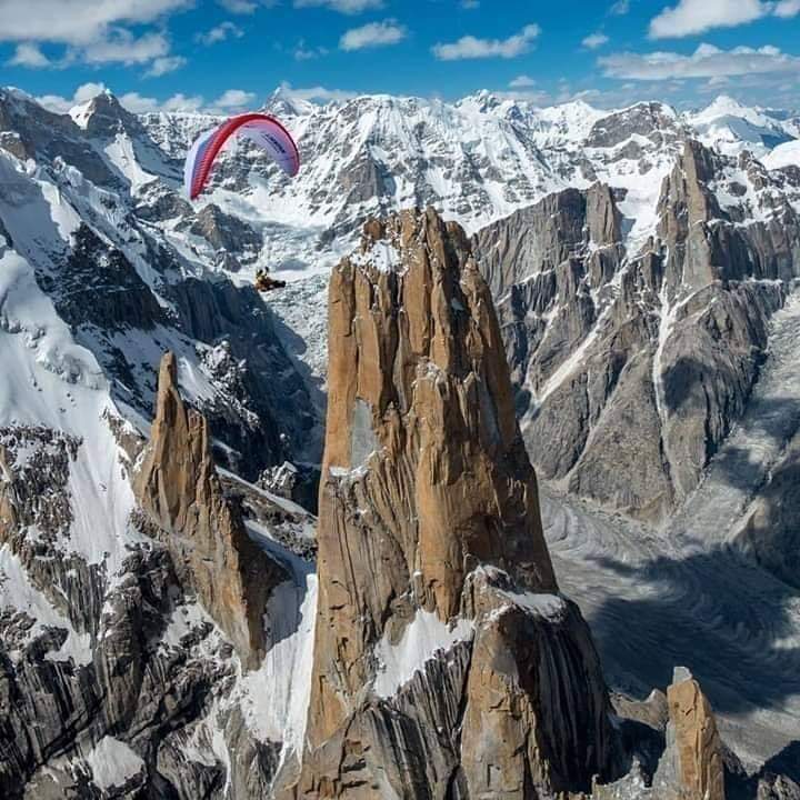 VisitMyPakistan's tweet photo. A spectacular view of paragliding in vicinity of #TrangoTower (world highest rock cliff).
#VisitMyPakistan https://t.co/wXXYe1SxJS