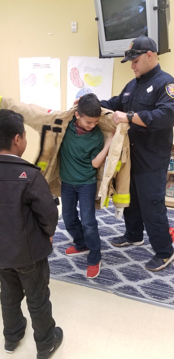 krios1022's tweet photo. My students were so excited to ask their questions and try on fire fighter gear! They were amazed at the connections they made from this weeks reading! #LPEPawsUp https://t.co/q6yxx3sjek