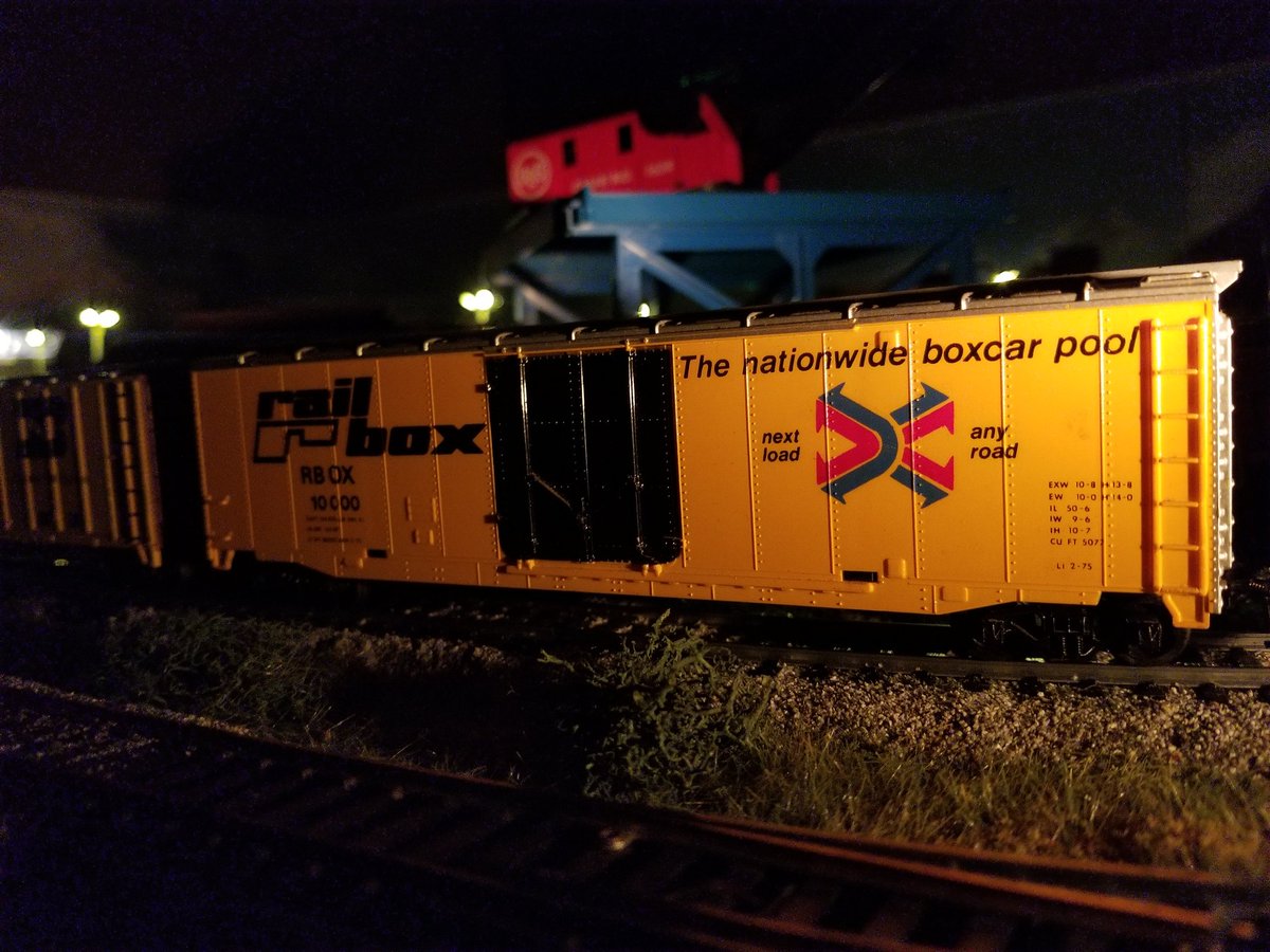 RegGFX's tweet photo. @TycoDepotdotcom This is a Night shot on my current layout of my ol Tyco Rail Box car, purchased by my Grandmother for me nearly 40 years ago. I honor her appreciation for my hobby as a kid by keeping it as is without weathering. Its just how she purchased it. #RealEnoughForMe https://t.co/sy4tYEtRqG