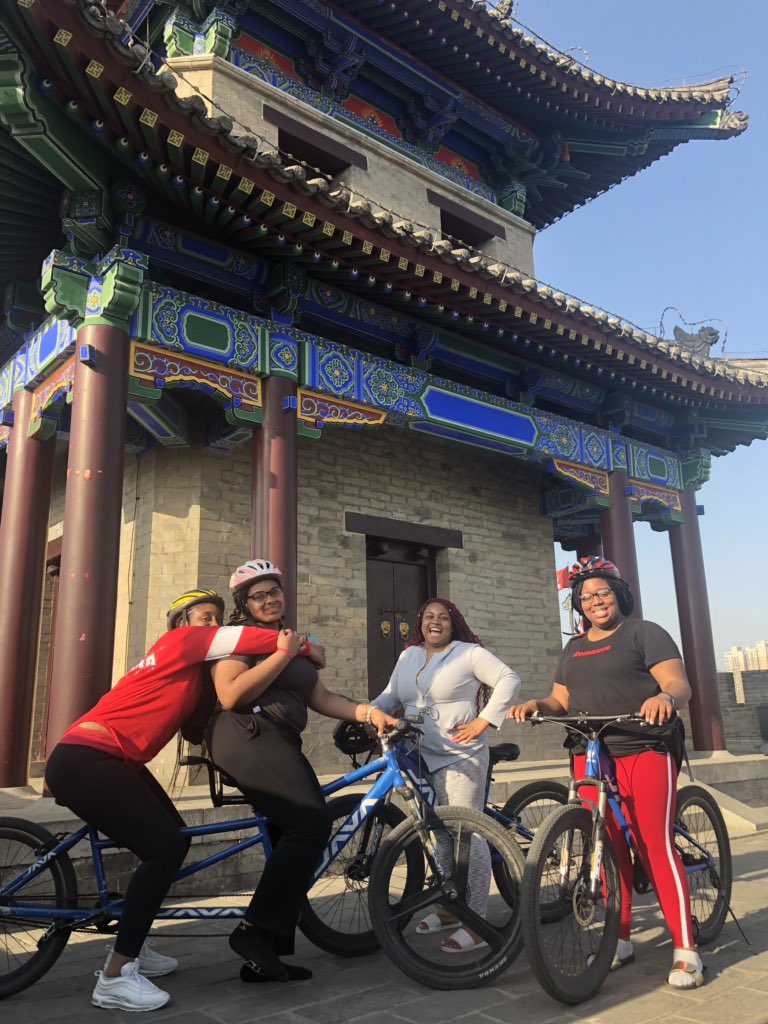 ari_riri's tweet photo. The city of Xi’an is a beautiful mix of old and new! And look at these cuties bike riding on the Old City Wall 😍🥰#studyabroad #BlackExcellence #lovemystudents @NealFSimeon_CA https://t.co/rOo2pbXv16