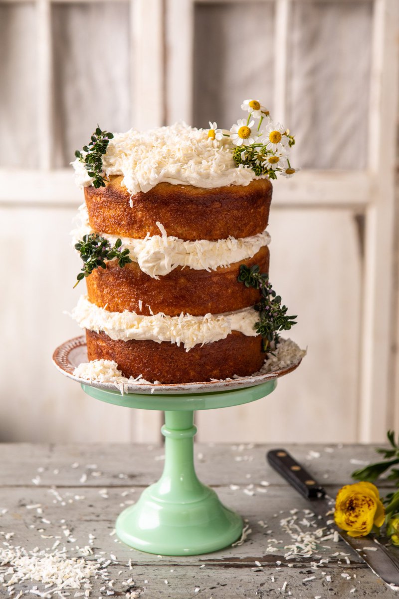 New! Lemon Coconut Naked Cake with Whipped Vanilla Buttercream. The pretty 'garden' cake that tastes amazing too. halfbakedharvest.com/lemon-coconut-… #coconutcake #springrecipes #easter #cake #layercake