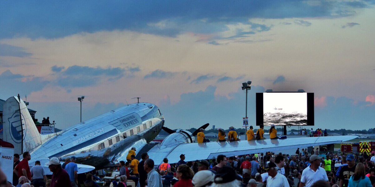 The beloved DC-3 Candler Field Express shares her wing for a beautiful night out at the movies at OSH17. #wingfriday