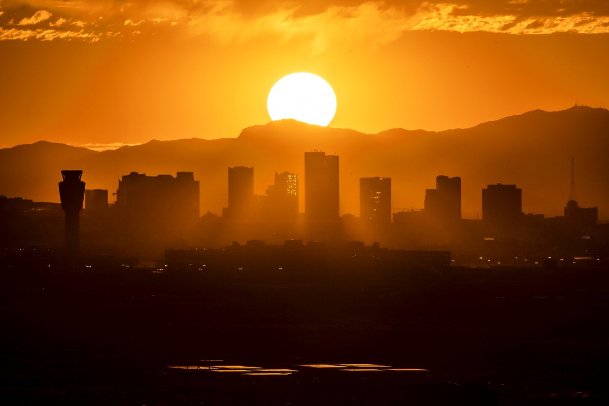 Sunset behind downtown Phoenix this evening with some cool rays between the buildings!