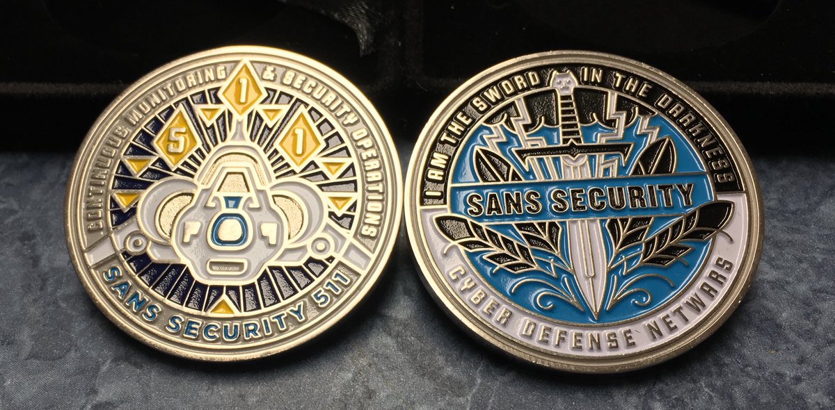 AndrewBohman's tweet photo. Just got home from Sans BlueTeam Summit and SEC511 training. Here is a picture of my spoils, two challenge coins. One from NetWars defense and the other from my class. Our team pull it off near last minute with a high 400s score out of 511. https://t.co/121FZtzfra