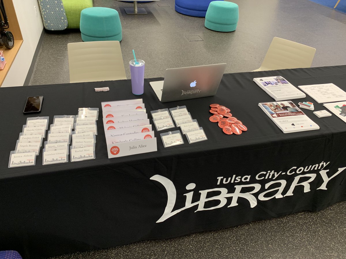 railsbridgetul's tweet image. Our check-in table at RailsBridge Tulsa is so convenient. Everyone has pretty name tags and volunteers have table tents. Even custom made Ruby buttons! Thank you @iamliterate and @cetulsalibrary for making it so easy to host the event here! We appreciate you!