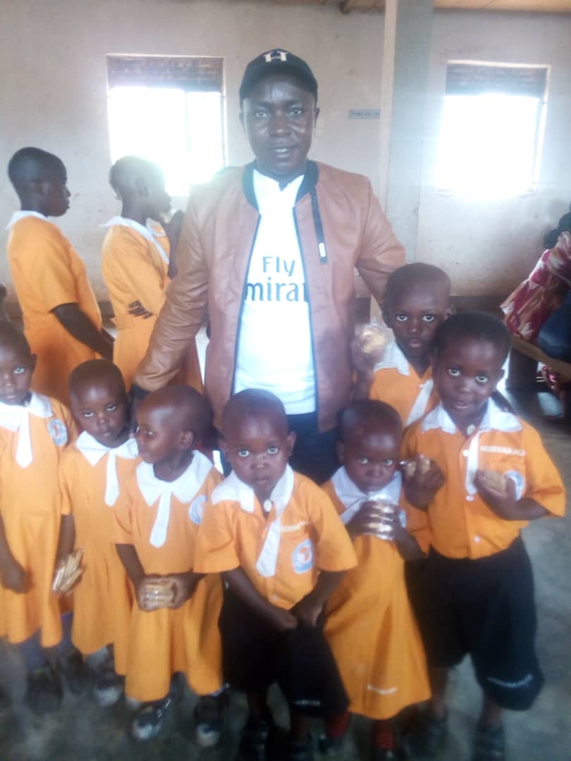 VisionInHope1's tweet photo. Musoke Seif checking on some of our tiniest students at Bright Africa Kyabakuza #CMAppreciationWeek https://t.co/UHC81PH5yU