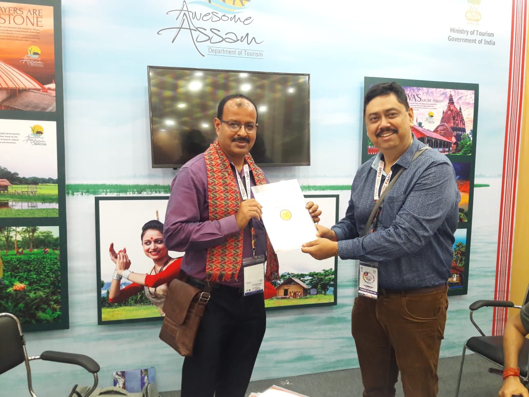 Dipak Sarma receiving Certificate of Participation from MD Assam Tourism, Best Travel Agent from Assam