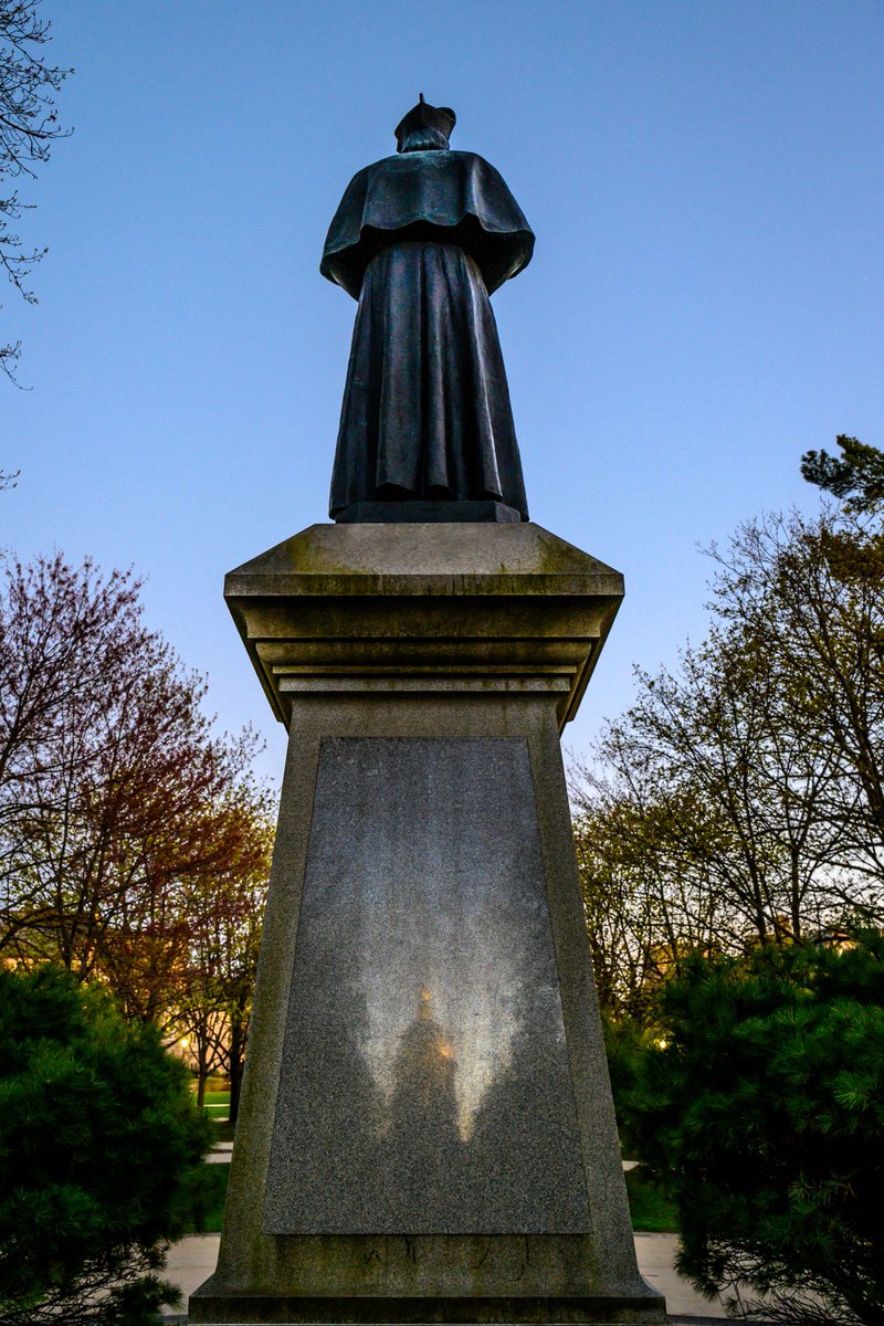 Made this on my way to Easter Vigil Mass - <a href="/NDMainBuilding/">Main Building</a> reflected in <a href="/FatherSorin/">Edward Sorin, C.S.C.</a>'s pedestal.