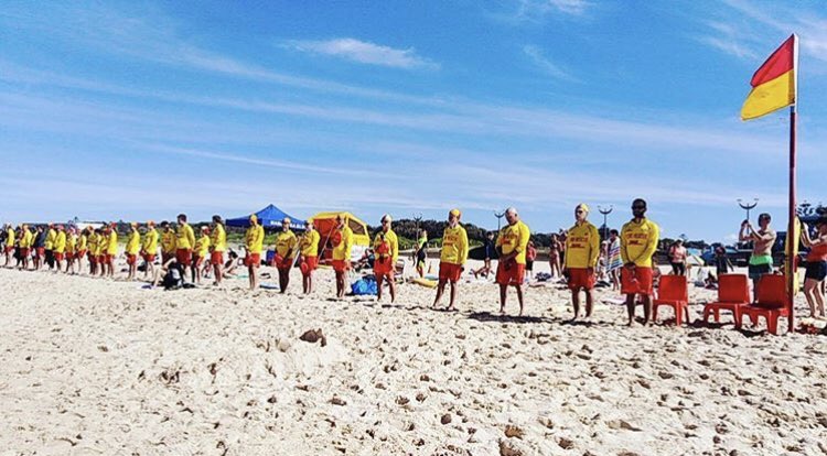 slsnsw's tweet photo. At 1230pm all NSW clubs stood in a line facing the water to honour our two fellow lifesavers who lost their lives yesterday. Andy and Ross Powell of Port Campbell SLSC will be remembered as heroes in red and yellow. condolences go out to family and friends of the Powells. #vale https://t.co/lVekhRHjKJ