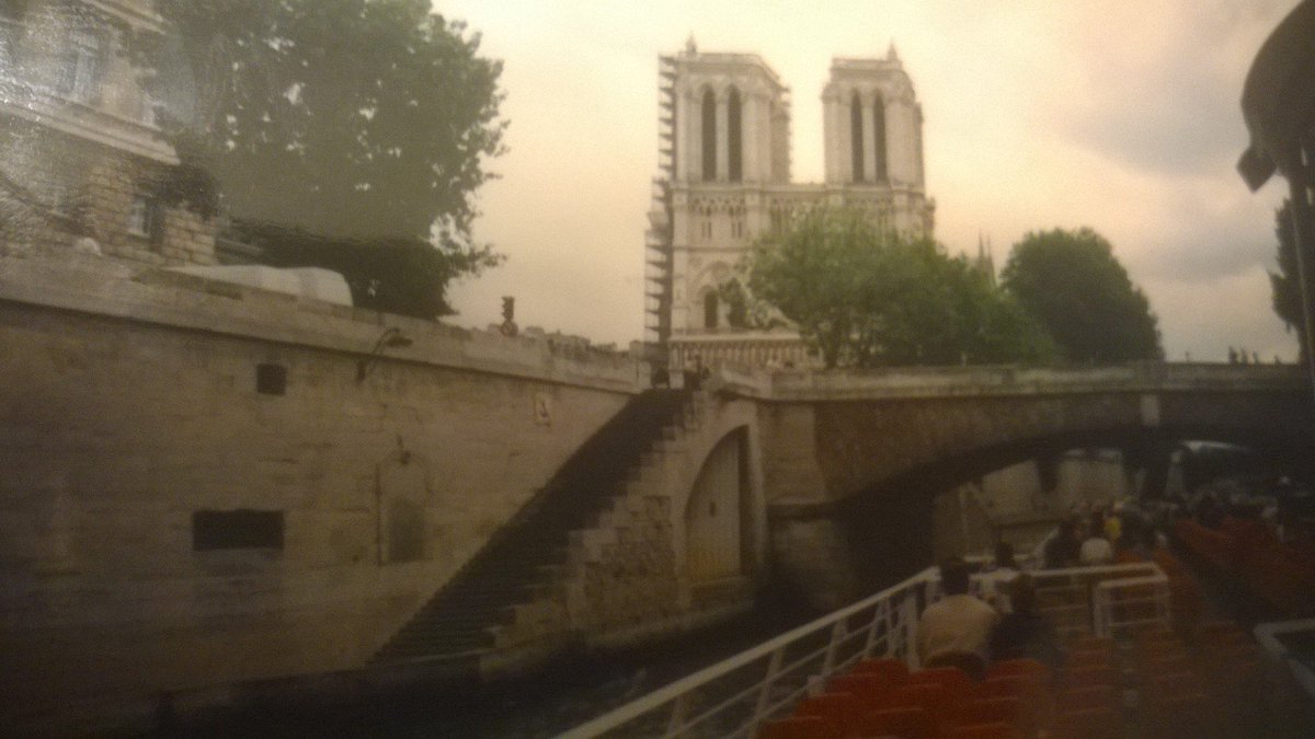 ThomasHardesty3's tweet photo. Another photo of Notre Dame Cathedral that we took on our Seine River cruise in June 2002, with the iconic twin bell towers in full view. On this Easter Sunday, still pondering the miracle of the towers surviving last Monday's devastating fire. #notredamecathedral #notredamefire https://t.co/ju9oxMO8kk