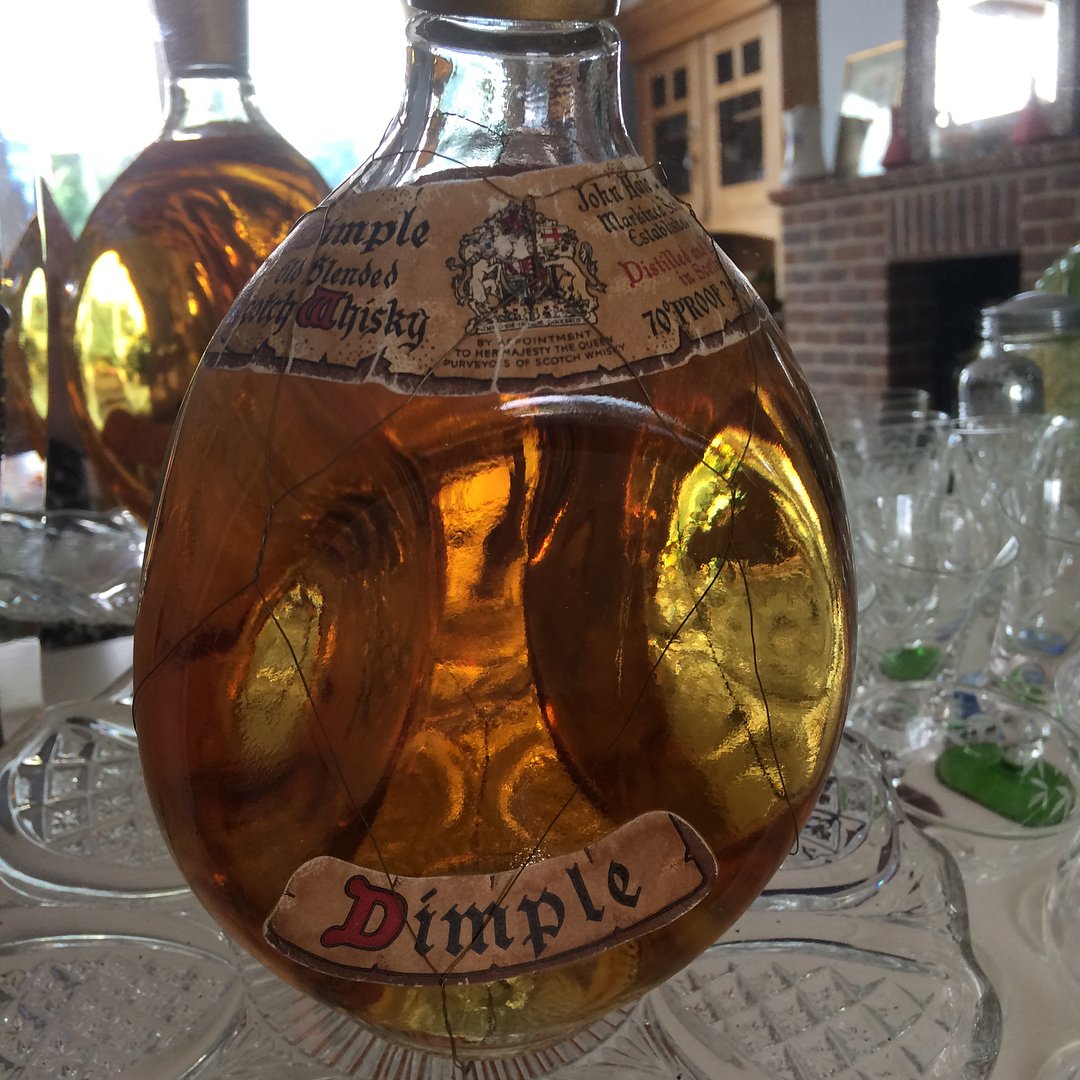 #repost @carole_webb_1962 Day 3 Bottle #merlesvintagechallenge I’m not a whisky drinker but love this old Dimple bottle, such a fabulous rounded shape and still with its delicate wire around the body intact #whisky #dimplewhisky #curves #bottle