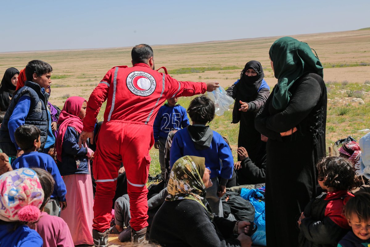 SYRedCrescent's tweet photo. For than two months now, the @SYRedCrescent is responding to the families getting out of  #Rukban #Camp toward the makeshift shelters in #Homs city. #SyrianArabRredCrescent volunteers has supported the families with relief items and primary health care services. https://t.co/D4hJFIvuOY