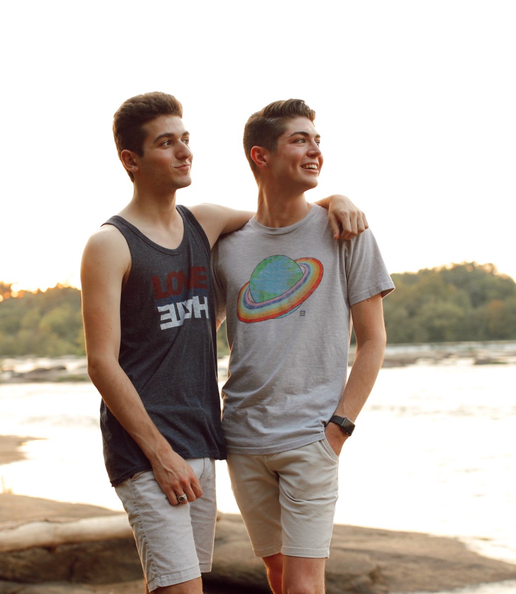 LGBTQ couple wearing HRC's Rainbow Earth T-shirt