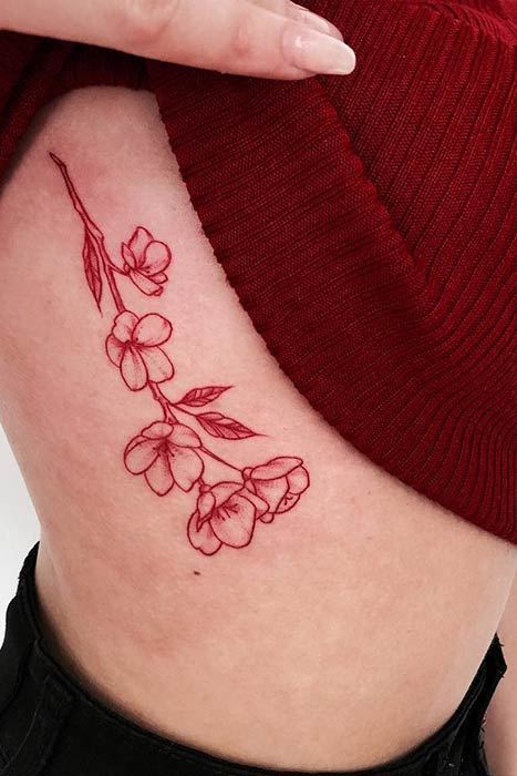 Minimalist red ink tattoo on the wrist  Red ink tattoos Finger tattoos  Small tattoos