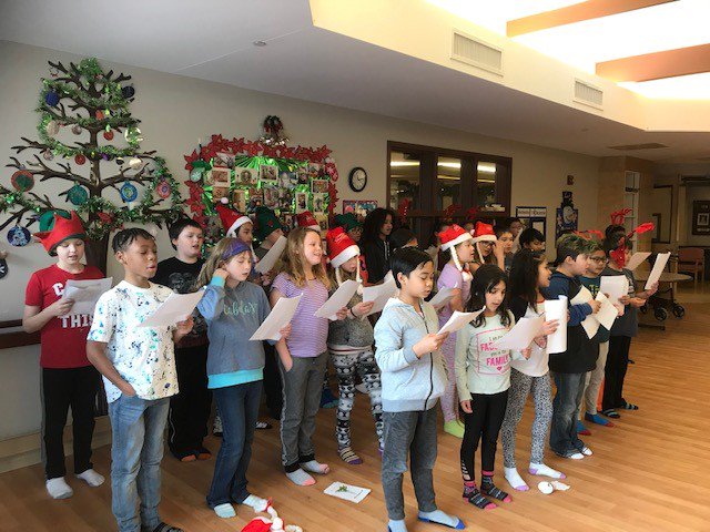 Students at St. Mary School love visiting our friends at Long Term Care to brighten their day! Here the Grade 4/5 class is pictured caroling and spreading Christmas cheer in preparation for their 2018 Christmas Concert. #ibelieveincatholiced #ecsrdJOY