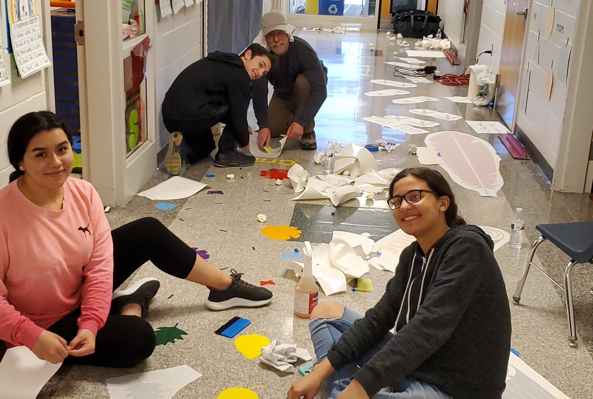Sharon53363694's tweet photo. Millbrook High School Students laying the #Wigglewalk for Orchard View students. #kidsdoingforkids Thanks to the Graphics II course for taking this project on. I cant wait to see the other 11 in our elementary schools. https://t.co/KgNlI4OXyL