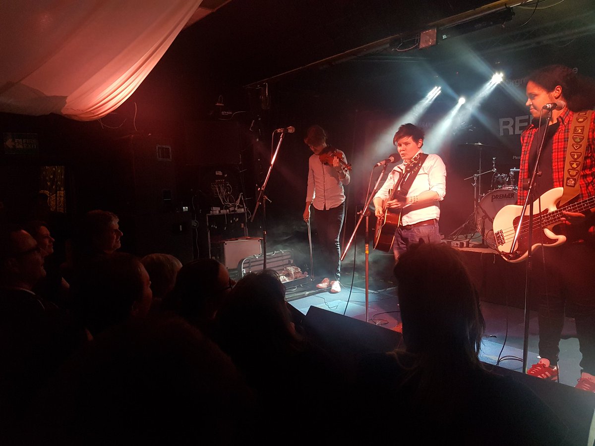 ComradeRockUK's tweet photo. Our headliner @gracepetrie and full band take to the stage and the room erupts. Happy #InternationalWorkersDay everyone!
#MayDayFest
#MayDay2019
#WSO2019 https://t.co/UO1qBnAM90