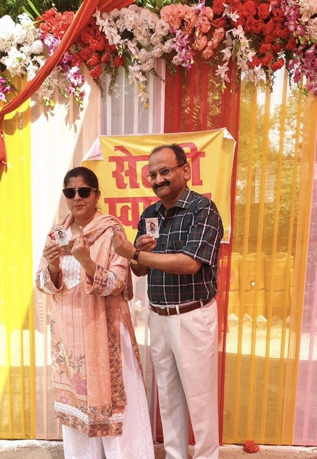 Cast my vote today in Lucknow along with wife Paridhi.