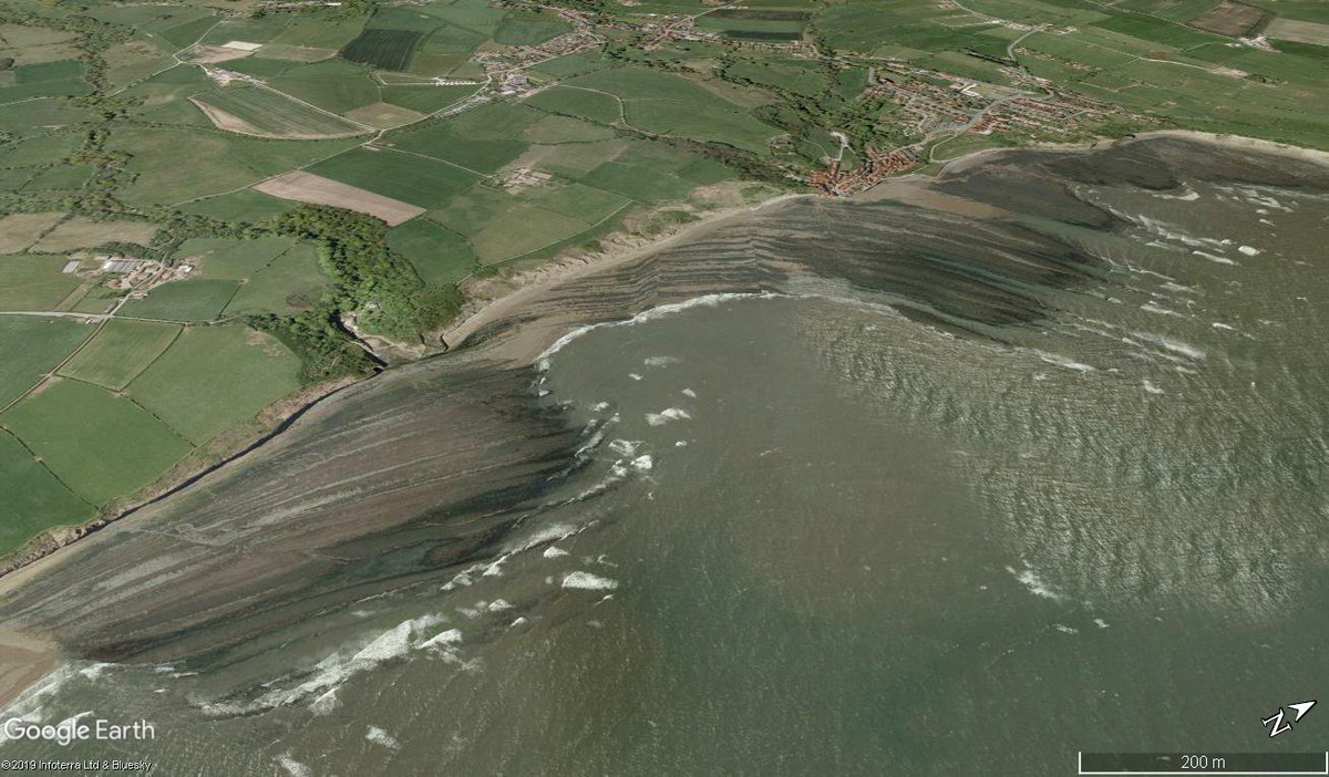 gmasselink's tweet photo. This #GECIMAGE shows the spectacular sloping (Type A) #shoreplatform of Robin Hood Bay. Despite the important role of weathering in shaping these features, GCSE/A-level syllabi still refer to these as 'wave-cut platforms'. This is why I wrote this update: https://t.co/pVz9qYiiJU. https://t.co/EqUsI7gzIl