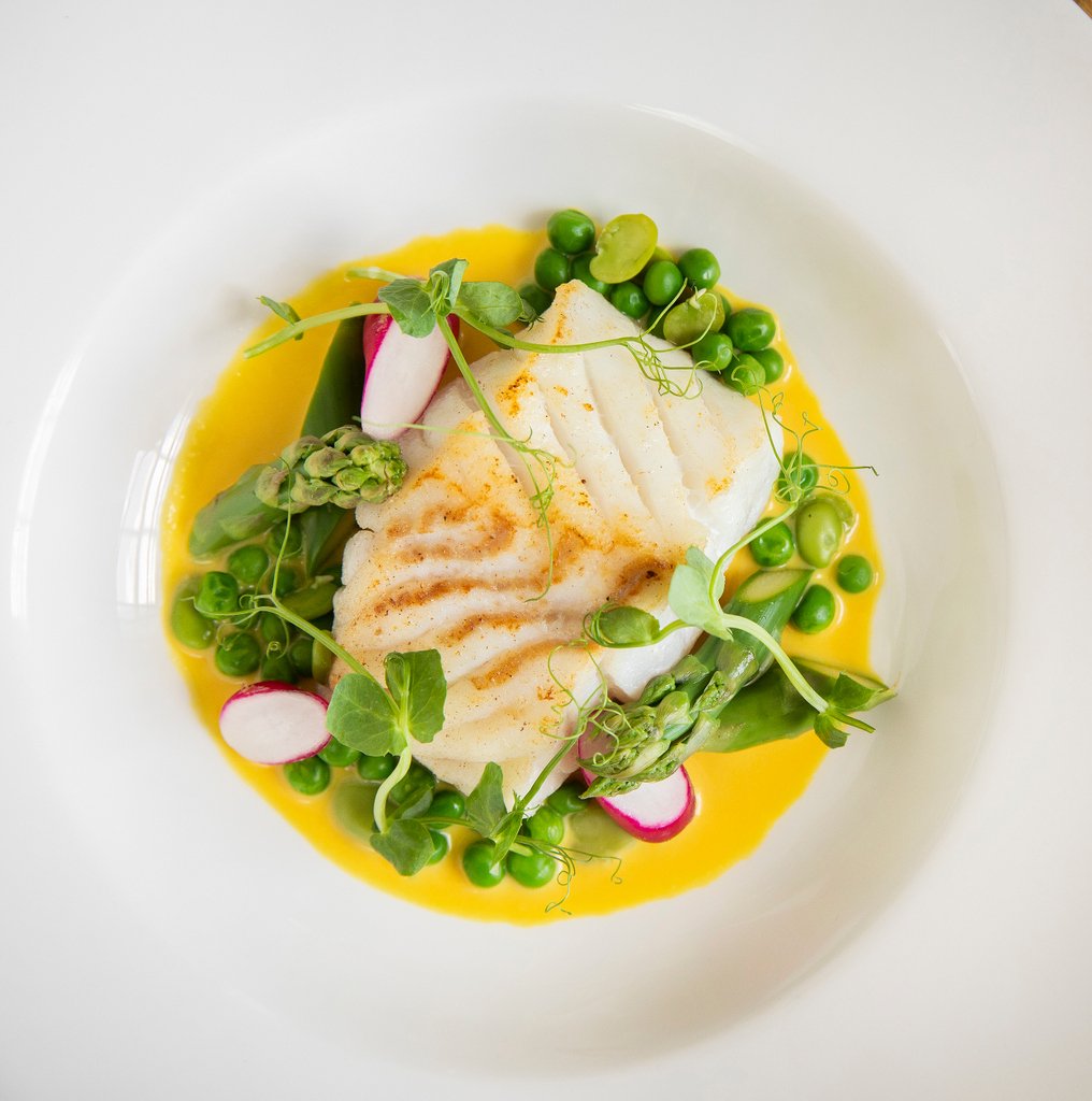 Pan-fried fillet of cod, with spring vegetables, and a deliciously decadent saffron cream sauce - a vibrant plate of fresh and delicious flavours to enjoy this week for lunch🍴