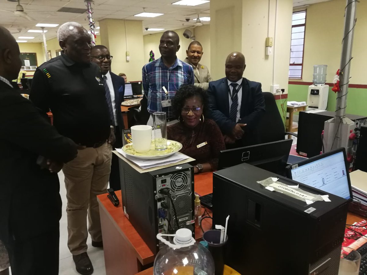 HomeAffairsSA's tweet photo. Min Cwele observes how Matshidiso Lehwete does a manual verification of documents submitted with an application for an enabling document #dha #ApplyNCollect https://t.co/t5lb7cbOVB