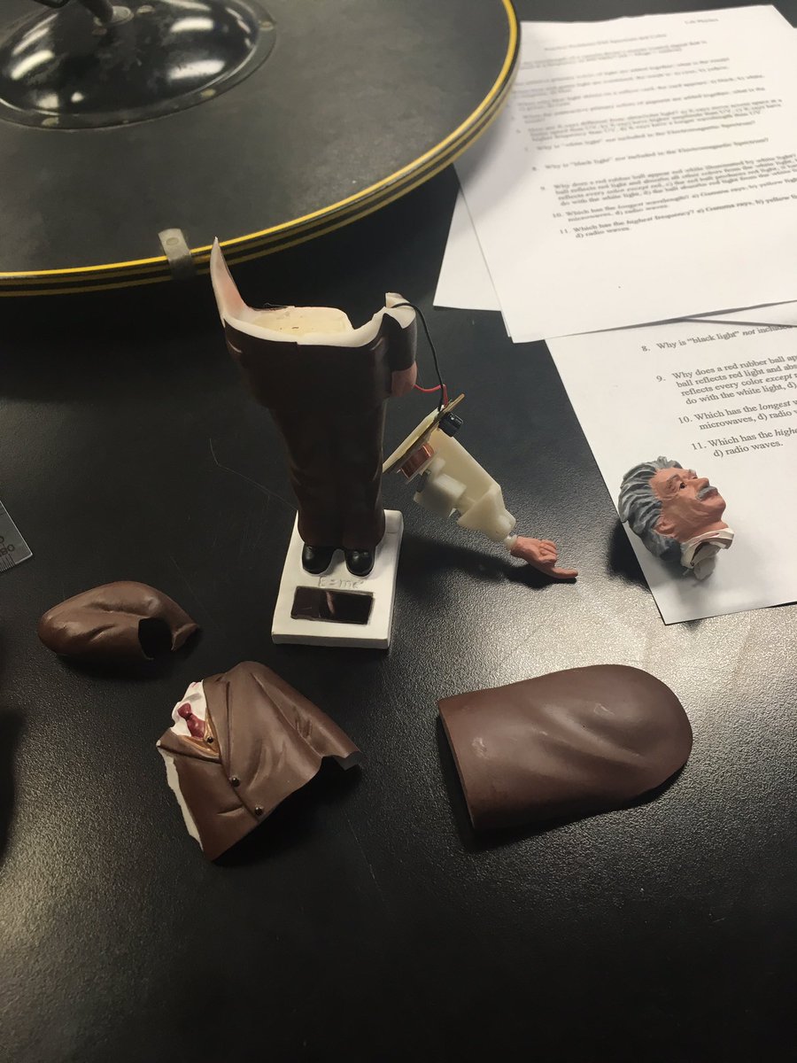 BrownsonPhysics's tweet photo. My students broke Einstein with their brilliant work in optics!!  (Or it could have been an elbow that did it 😂) Either way, check out the capacitor, the coil of wire (called a solenoid), and the magnet!  All wired to a solar cell to make his finger wag back and forth. https://t.co/RbeFxviQj2