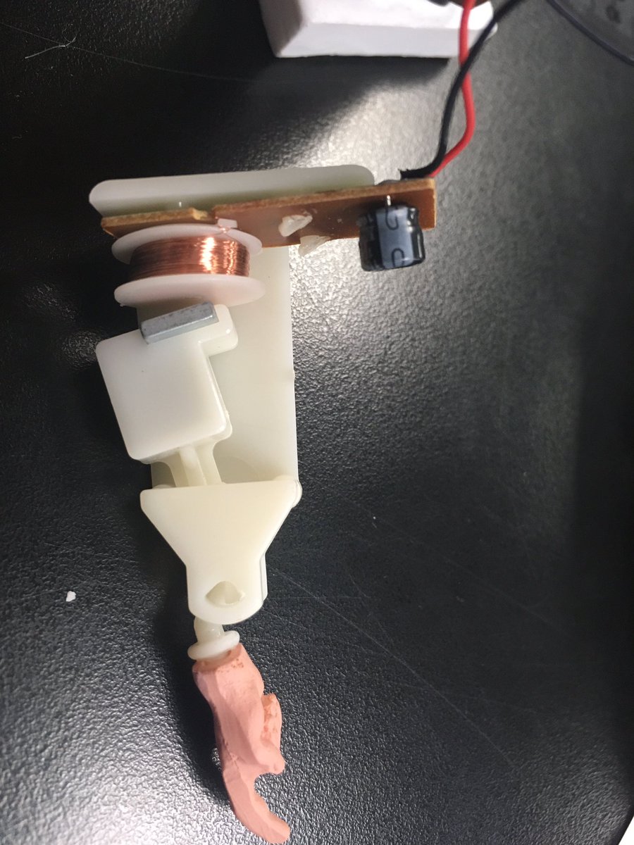 BrownsonPhysics's tweet photo. My students broke Einstein with their brilliant work in optics!!  (Or it could have been an elbow that did it 😂) Either way, check out the capacitor, the coil of wire (called a solenoid), and the magnet!  All wired to a solar cell to make his finger wag back and forth. https://t.co/RbeFxviQj2