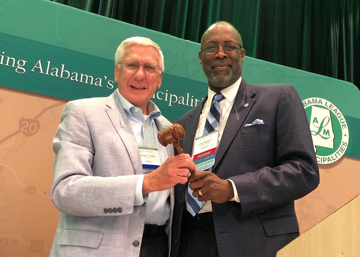AL_League's tweet photo. Council President Jesse Matthews of Bessemer passed the gavel to Mayor Ronnie Marks of Athens at the 2019 Business Session. Congratulations to Mayor Marks and Mayor Leigh Dollar of Guntersville who were elected 2019-2020 President and Vice President! #ALMCon19 https://t.co/ADqfl2fOoG