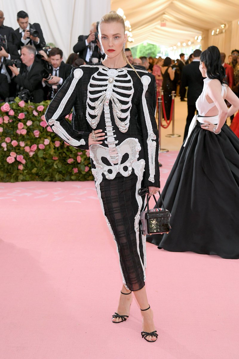 The skeleton on this Thom Browne gown on Caroline Trentini is made of  pearls, rhinestones, and nine zillion beads.... which is what your insides  look like if you live on a diet