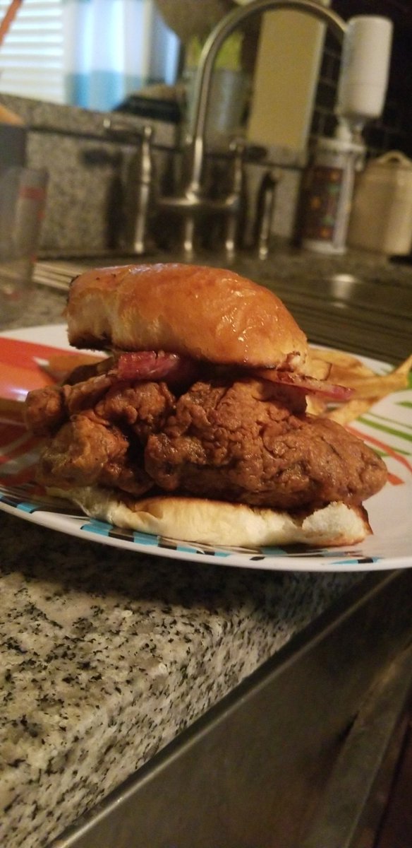 UncleViz's tweet photo. Deliciously crispy and very Juicy Fried Chicken Sandwich with bacon, special sawce, on a freshly baked brioche bun with a side of home made fries. #chicken #friedchicken #chickensandwhich #frenchfries #chef #food #homemade #bombasschicken https://t.co/VvUDKZ0Isg