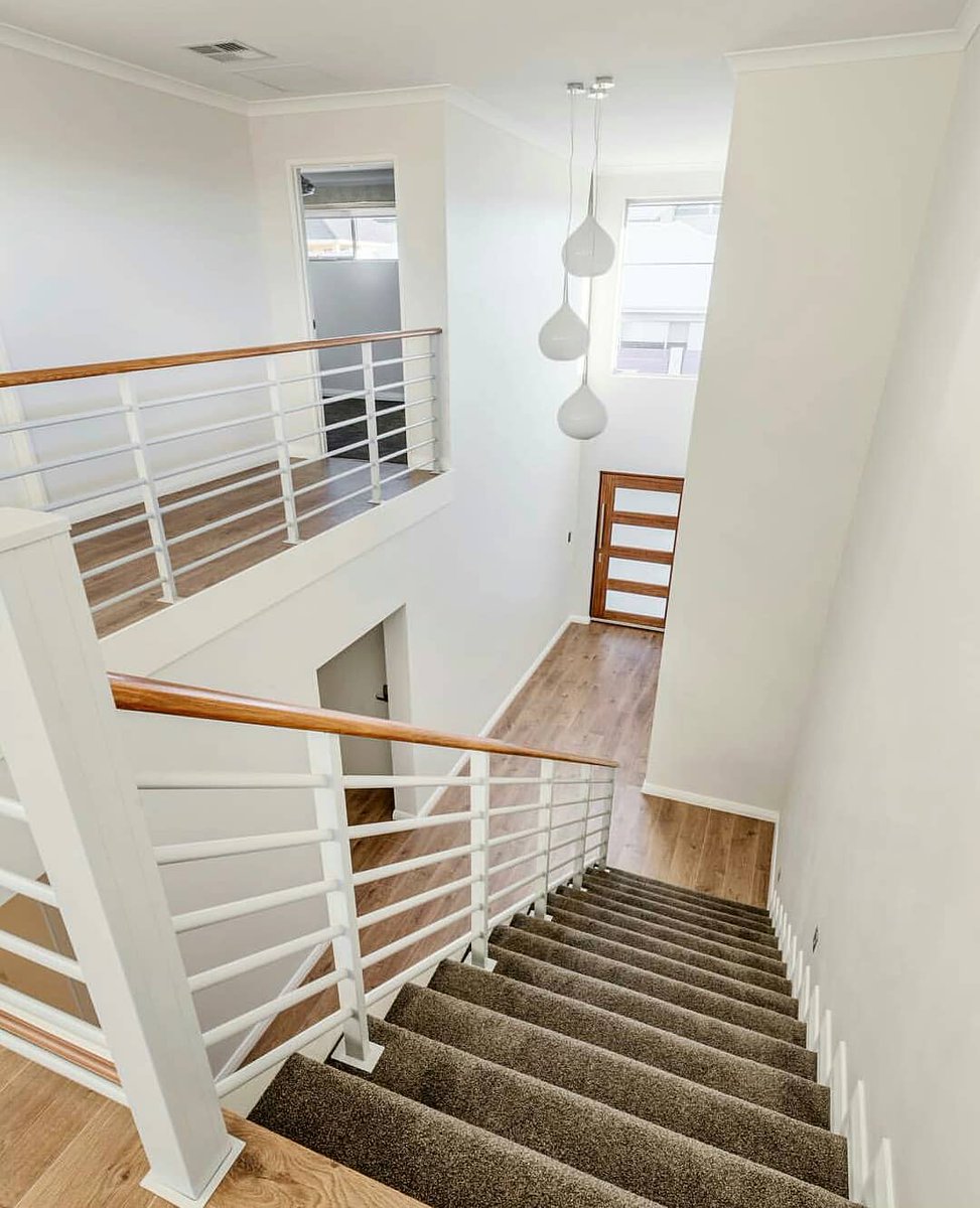 BalustradingWA's tweet photo. Make an Entry Statement. 
@BalustradingWA 'Stirling' balustrade with Tassie Oak timber handrail.
#balustrade
#doublevoid
#featurelighting
#timberfloors https://t.co/KBYBuhA35a
