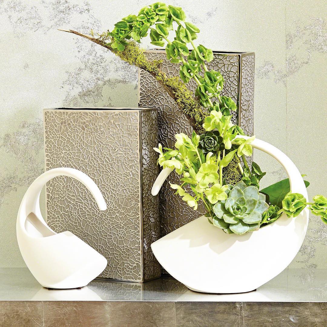 snugmodern's tweet photo. Inspired by an earring, these ceramic Cleopatra vases have a matte white glaze and an asymmetrical tilt that would make any modern floral arrangement chic. 🌺🌱 https://t.co/ap0gpjGbIZ