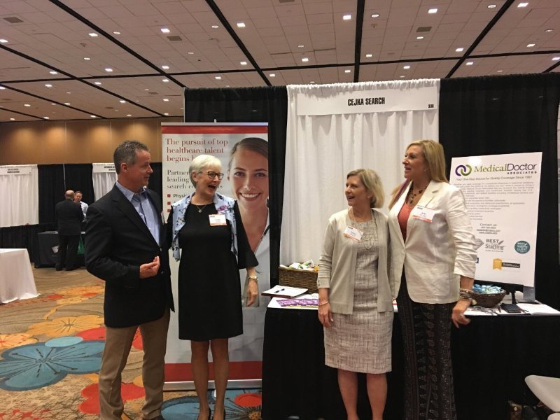 cejkasearch's tweet photo. The Cejka Search and MDA team are all smiles at TX MGMA this week. Great to see (from right to left): Kiki Tveitnes and Nancy Burke (MDA) with Cindy Stokes and Tim O'Brien (Cejka Search). If you are attending TX MGMA, stop by and say hello! #texasmgma #healthcare #recruitment https://t.co/DXqmcMgdGL