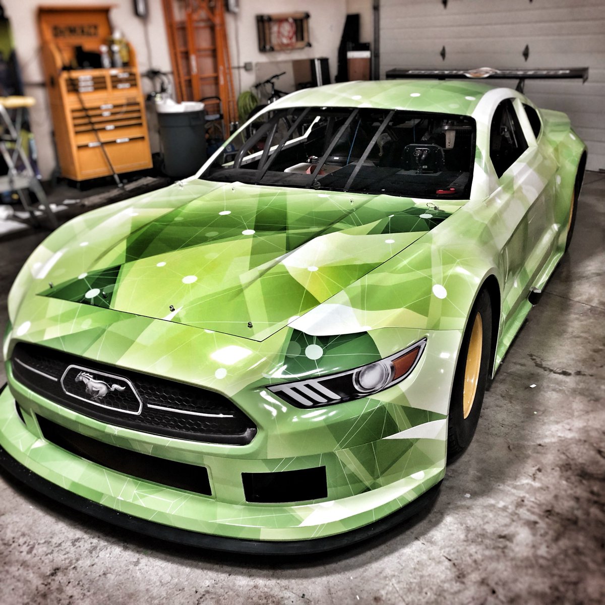 GMediaWraps's tweet photo. Love the way this #vehicleWrap turned out. Almost a shame to put race and sponsor decals on top of this design. It’s definitely ready to turn some heads on the #racetrack. #mustang #racecar #surfacesolutions #fiveStarBody #mustangRaceCar #TA2 #mutohAmerica #arlongraphics https://t.co/Ufh6SmOThw