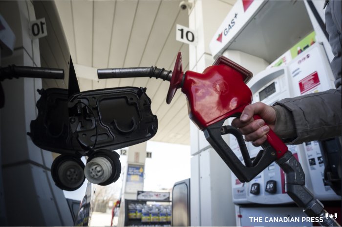 A woman fills up her with gas in Toronto, on Monday April 1, 2019. Canada's budget watchdog says revenues from the federal carbon price will be more than $2.6 billion this year and exceed $6 billion within five years. THE CANADIAN PRESS/Christopher Katsarov