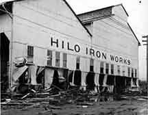 The Hilo Iron Works building, which is still standing today near Wailoa River, withstood heavy damage in the 1946 tsunami. (PTM Nakagawa Collection) #TBT #TsunamiAwarenessMonth