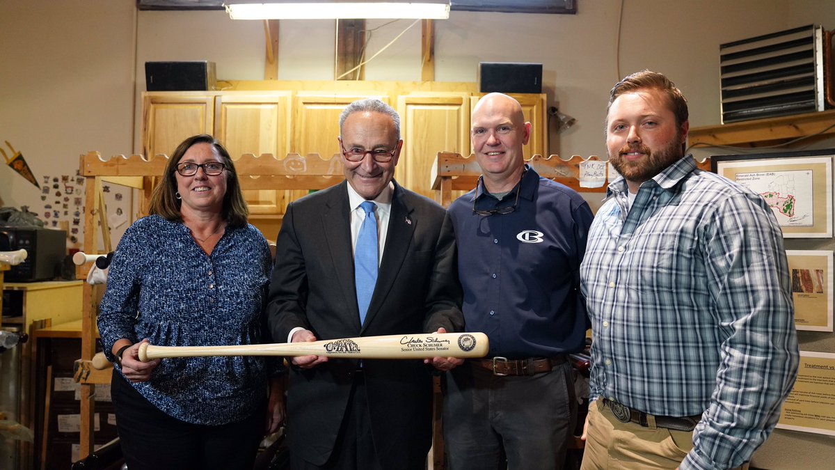 Senator Schumer poses with a bat at Cooperstown Bat Company. (Photo by the Senate Democratic Media Center)