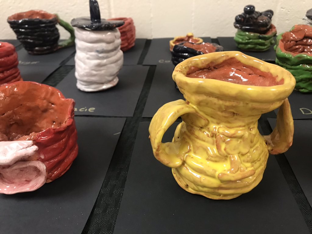 End of year art show with second grade #coilpots on display.