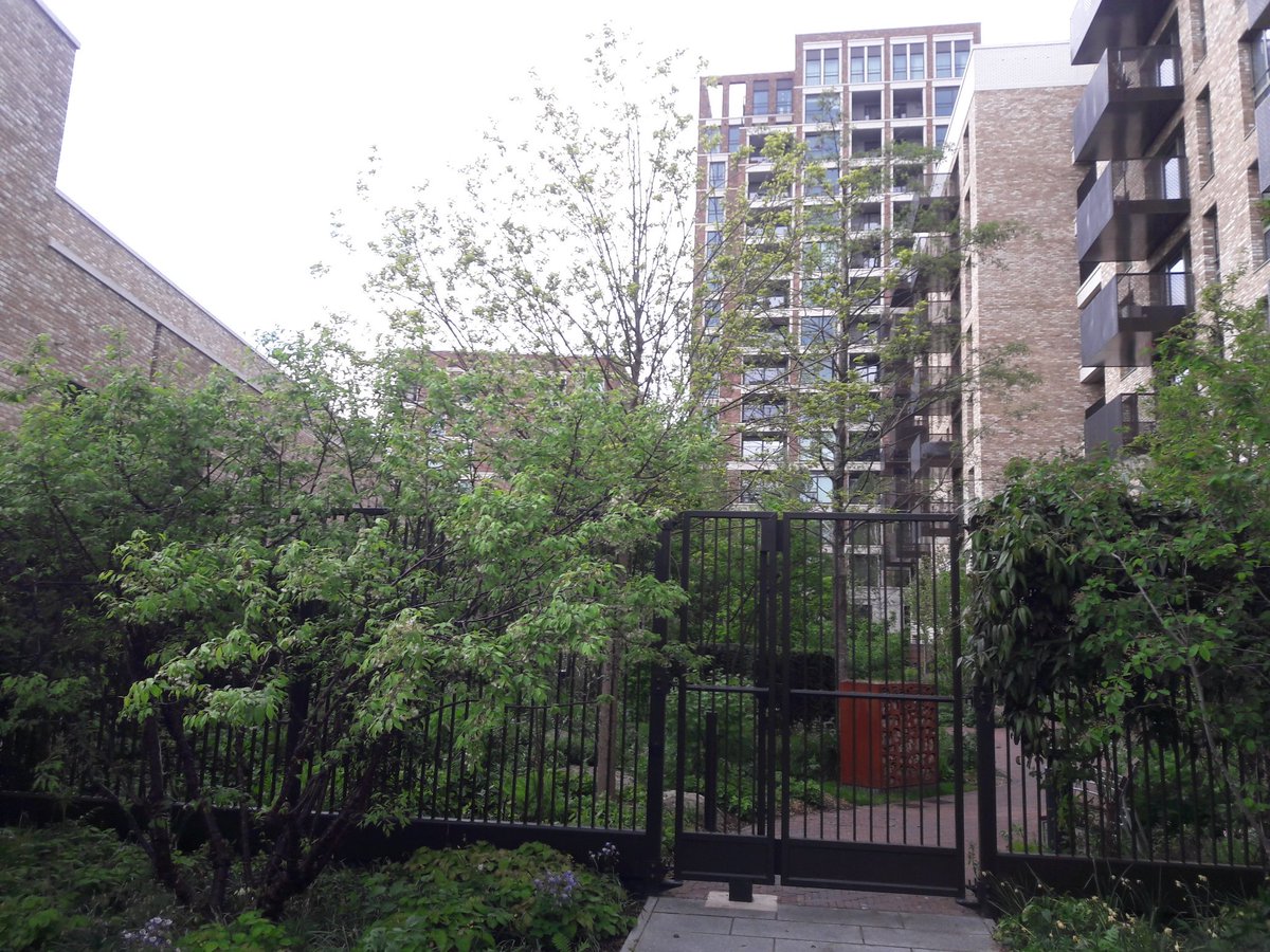 Here's the CGI vs actual photo of the redeveloped Heygate estate's new green spaces - somehow the CGI missed the 8ft railings and key fob controlled gate..