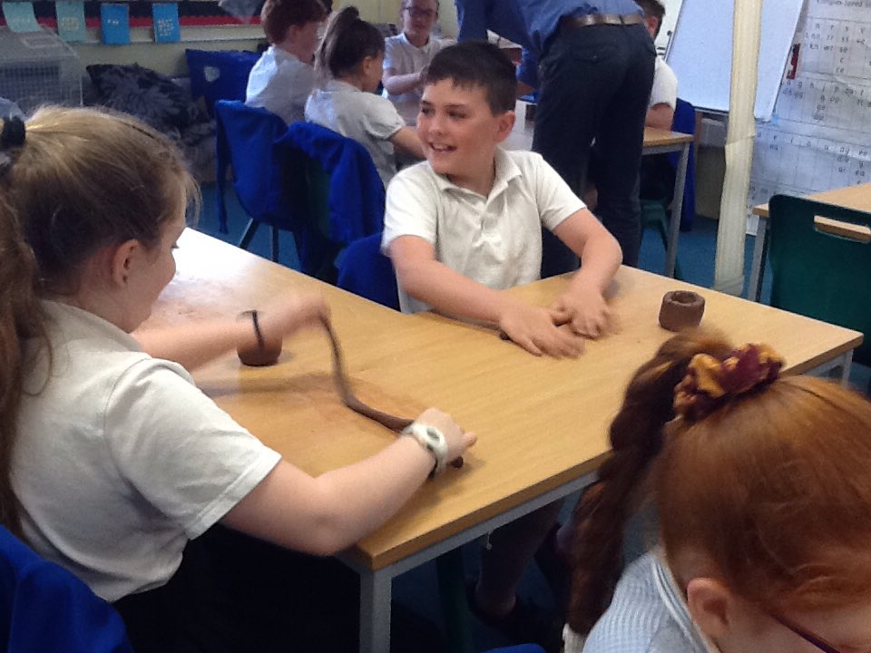 We have been making our own Greek vases using clay. They are starting to take shape.