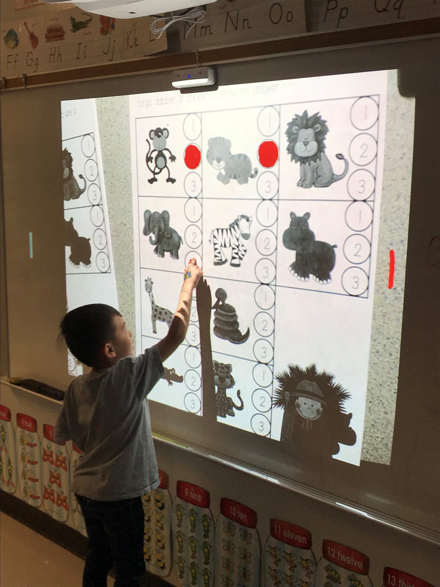 Ms. Harrod's kindergarten students using our new short throw interactive projectors!